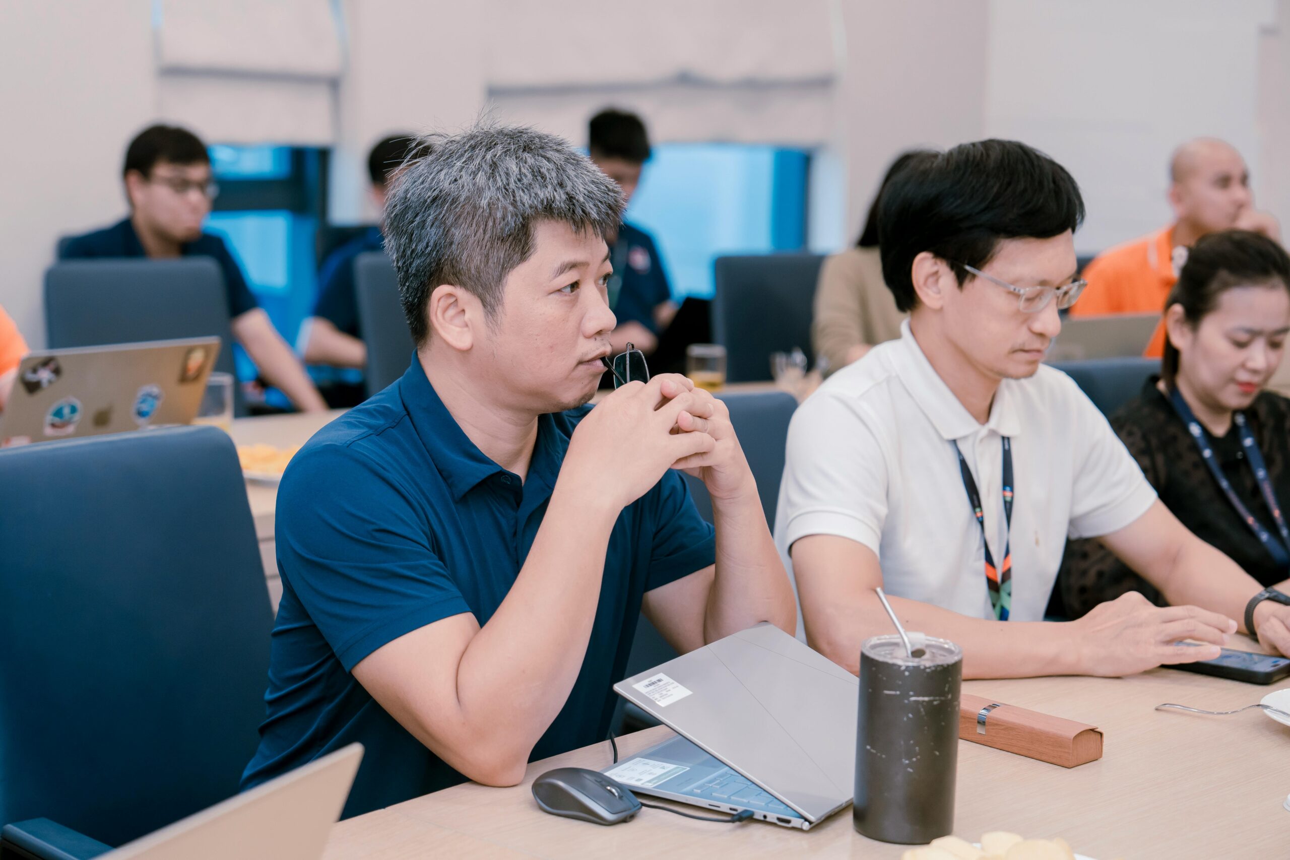 Colleagues in discussion at a shared workspace