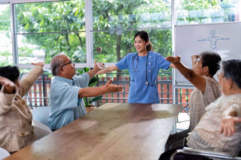 Caregiver supporting an elderly woman at home, the practical focus of elderly care courses in Singapore
