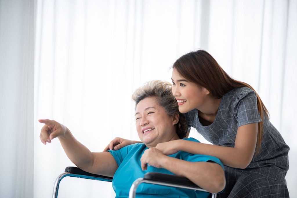 Learners practising caregiving techniques during a WSQ eldercare course classroom session